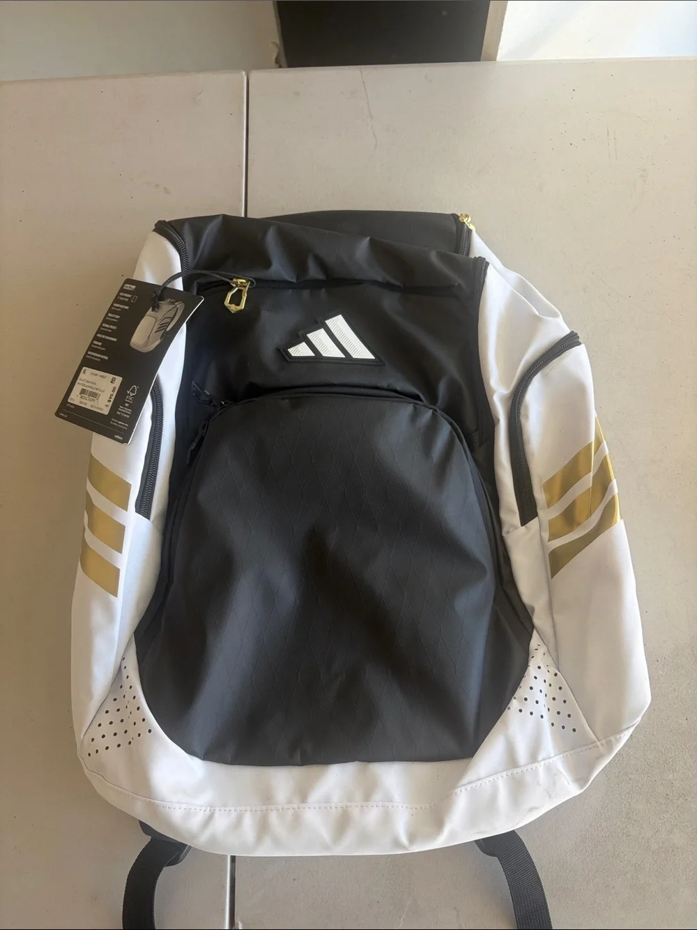 adidas Black and White Backpack with Gold Stripe Accents
